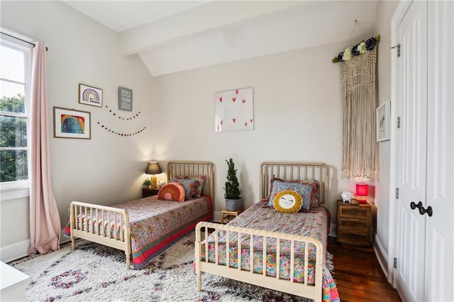 bedroom featuring vaulted ceiling with beams and dark hardwood / wood-style floors