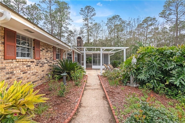 view of yard with a sunroom