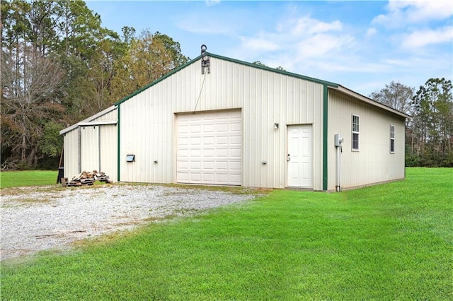 detached garage featuring driveway