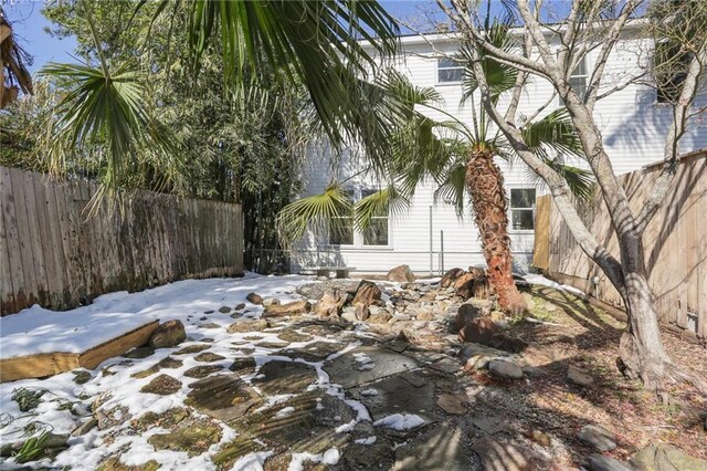 view of snow covered property