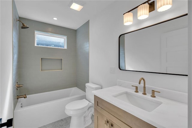 full bathroom featuring tiled shower / bath, vanity, toilet, and tile patterned flooring