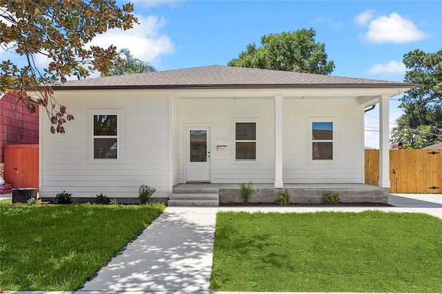 bungalow-style home with a front yard