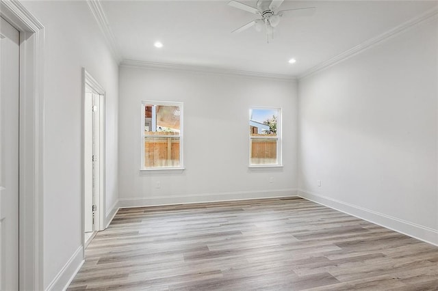 unfurnished room with ceiling fan, ornamental molding, and light wood-type flooring