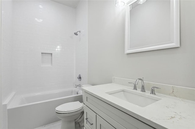 full bathroom featuring vanity, toilet, and tiled shower / bath combo