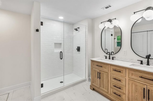 full bath with a stall shower, visible vents, marble finish floor, and a sink