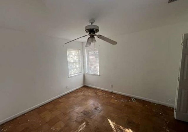 unfurnished room featuring ceiling fan