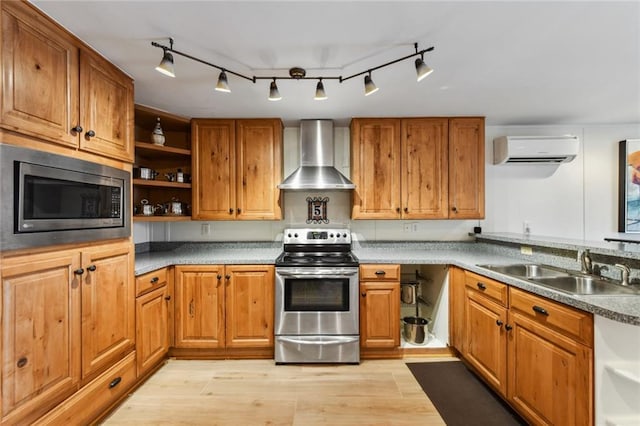 kitchen featuring open shelves, appliances with stainless steel finishes, wall chimney exhaust hood, a wall mounted AC, and a sink