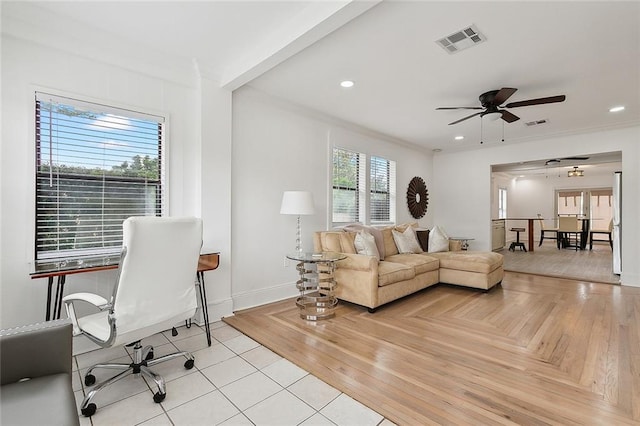 interior space featuring crown molding and ceiling fan