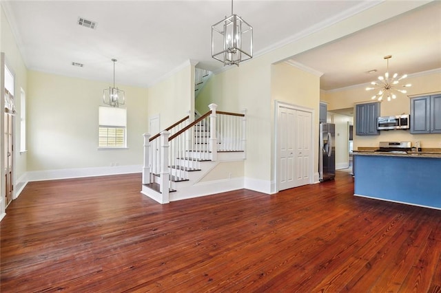 interior space featuring ornamental molding, dark wood-type flooring, and a chandelier