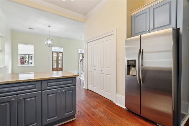 kitchen featuring gray cabinetry, stainless steel fridge with ice dispenser, light stone countertops, and dark hardwood / wood-style floors