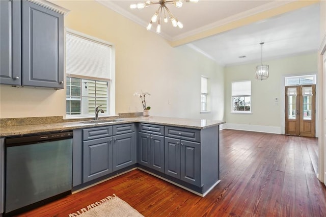 kitchen with a notable chandelier, dark wood-type flooring, dishwasher, and plenty of natural light