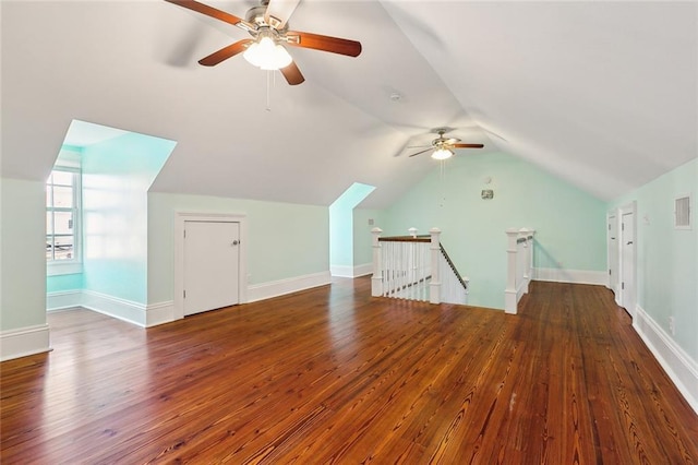 bonus room featuring dark hardwood / wood-style flooring and lofted ceiling