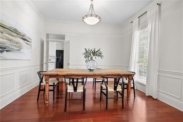 dining space with crown molding, dark hardwood / wood-style floors, and a healthy amount of sunlight