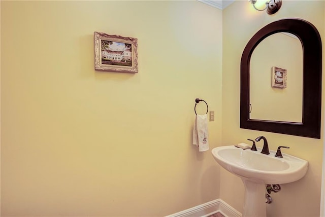 bathroom with crown molding