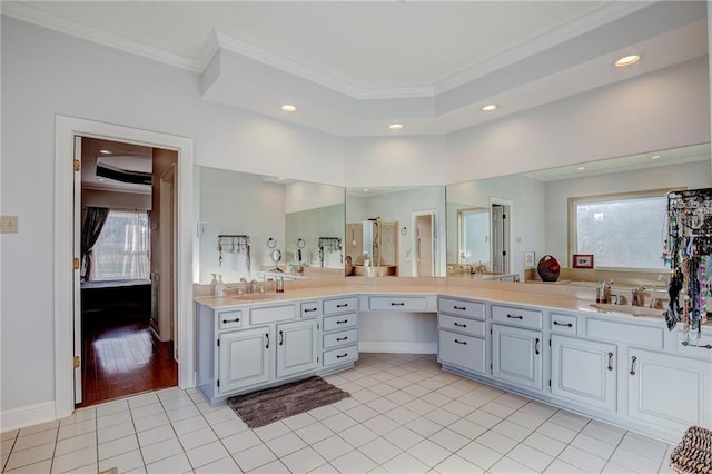 bathroom featuring vanity, crown molding, and tile patterned floors