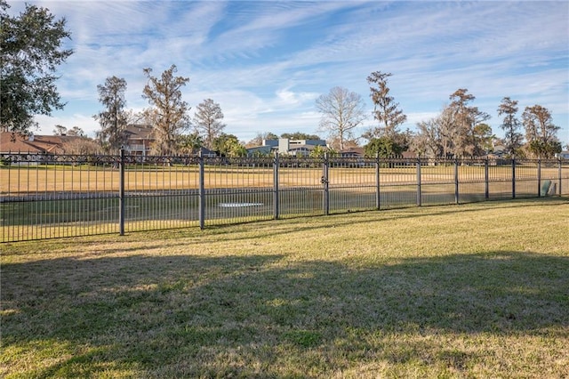 view of basketball court with a lawn