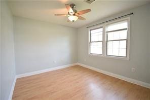 unfurnished room with ceiling fan and light wood-type flooring