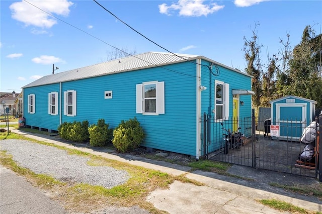 view of home's exterior featuring a storage shed