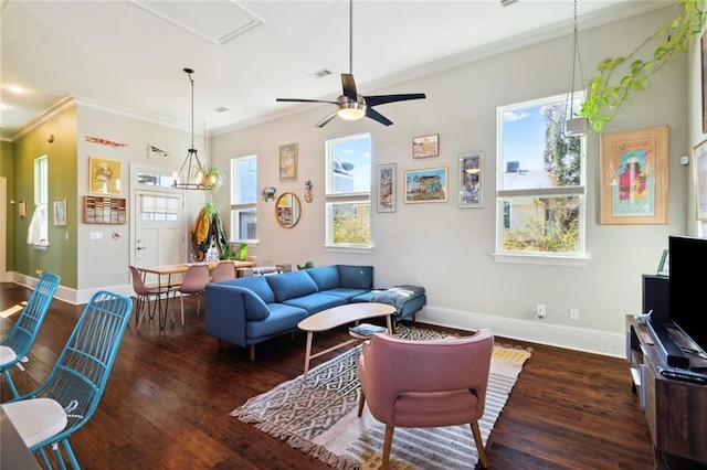 living room with ornamental molding, dark hardwood / wood-style floors, and ceiling fan