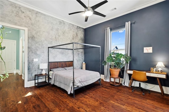 bedroom featuring crown molding, dark wood-type flooring, and ceiling fan