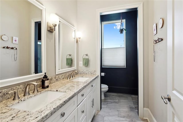 bathroom with vanity and toilet