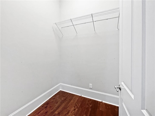 walk in closet featuring hardwood / wood-style floors