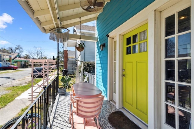 doorway to property featuring ceiling fan