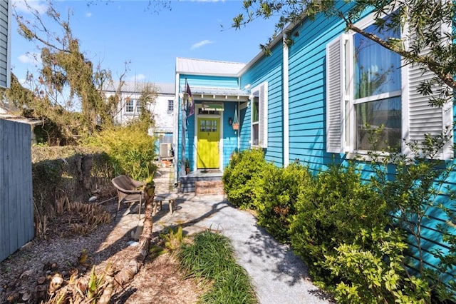 doorway to property featuring a patio