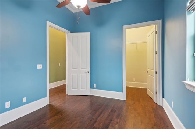 1841 Rosiere St, New Orleans, LA 70119 - unfurnished bedroom with wood finished floors, a walk in closet, baseboards, and a closet