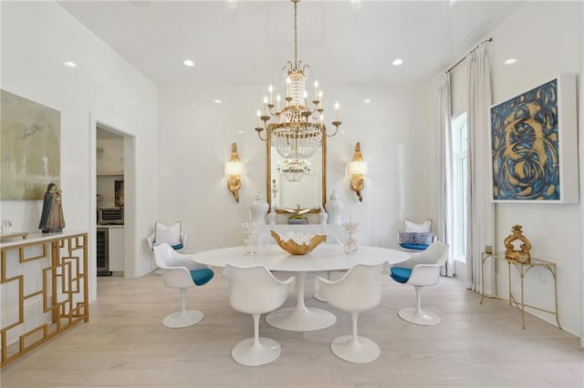 dining area with plenty of natural light, wine cooler, light wood-type flooring, and breakfast area