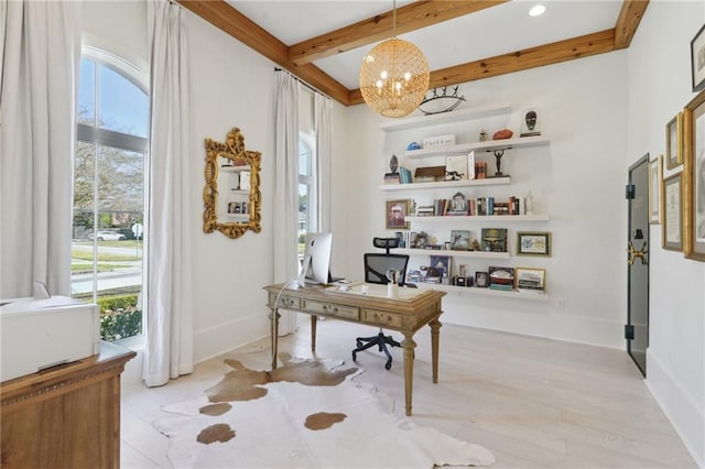 home office featuring beam ceiling and a chandelier