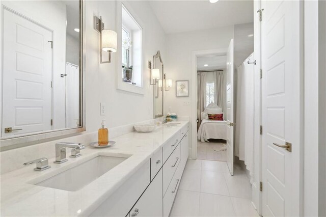 bathroom with vanity and tile patterned flooring