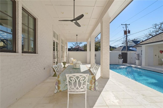 view of pool featuring a patio and ceiling fan