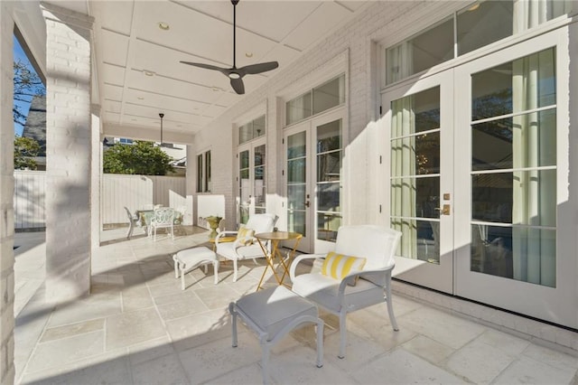 view of patio with french doors and ceiling fan