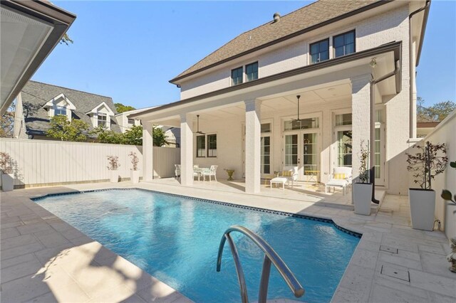 view of pool featuring a patio area and ceiling fan