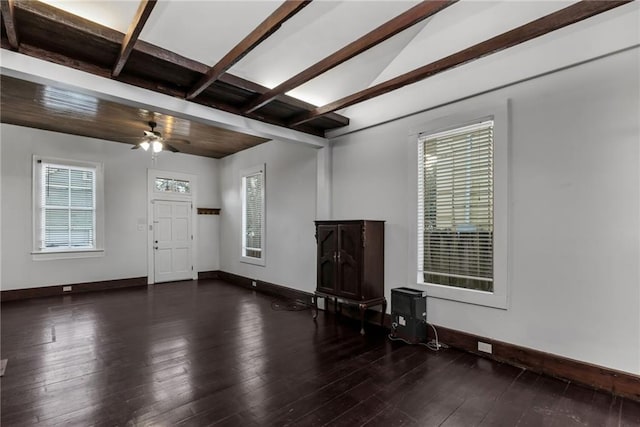 interior space featuring beamed ceiling, dark hardwood / wood-style floors, and ceiling fan