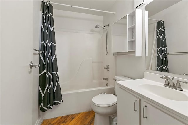 full bathroom featuring vanity, wood-type flooring, toilet, and shower / bath combo with shower curtain