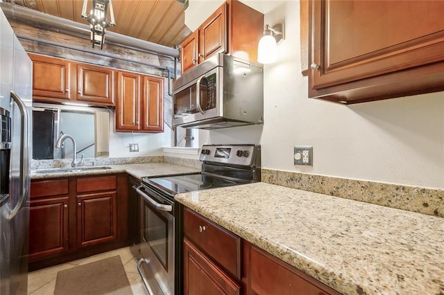 kitchen featuring sink, wood ceiling, light tile patterned floors, appliances with stainless steel finishes, and light stone countertops