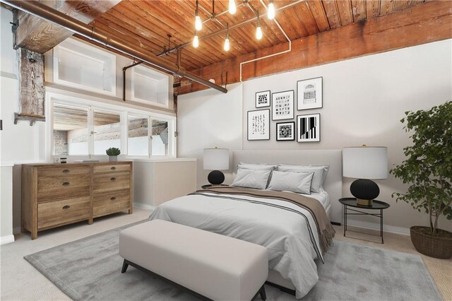 carpeted bedroom with wooden ceiling