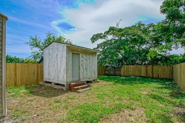 view of outbuilding featuring a lawn