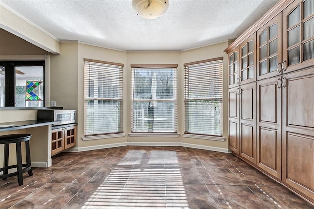 109 Lefleur Dr, Slidell, LA 70460 - unfurnished dining area with a textured ceiling and crown molding