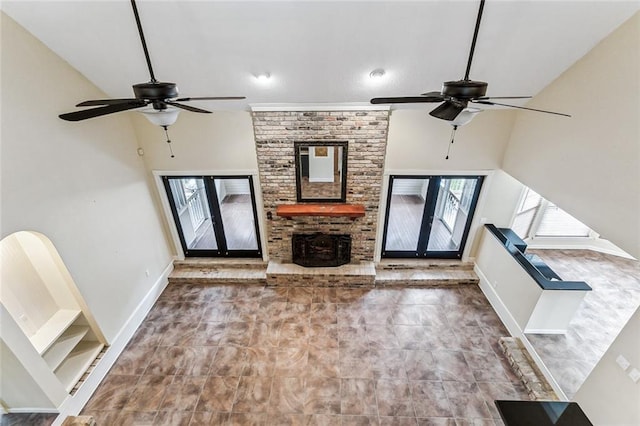 109 Lefleur Dr, Slidell, LA 70460 - unfurnished living room featuring a ceiling fan, healthy amount of natural light, a high ceiling, and a fireplace