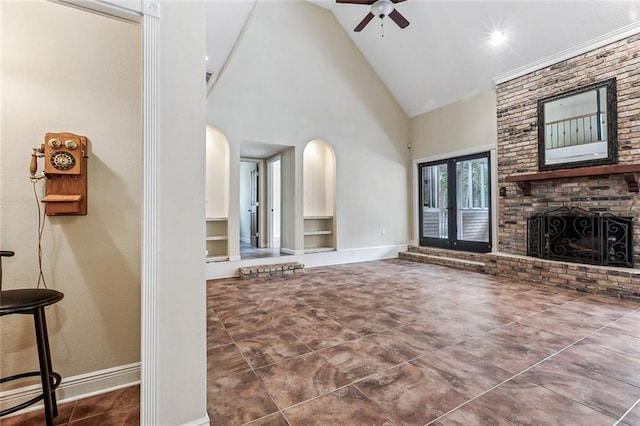 109 Lefleur Dr, Slidell, LA 70460 - unfurnished living room with high vaulted ceiling, ceiling fan, arched walkways, a brick fireplace, and built in features