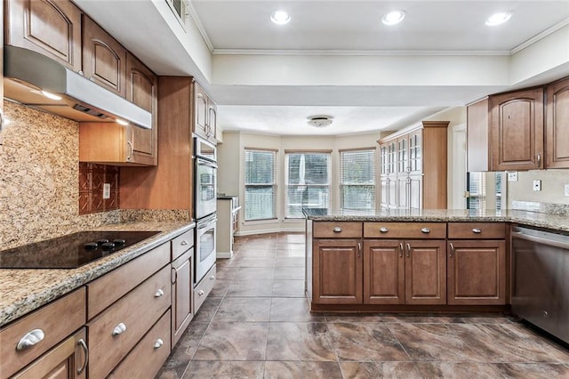 109 Lefleur Dr, Slidell, LA 70460 - kitchen featuring stainless steel appliances, under cabinet range hood, backsplash, light stone countertops, and ornamental molding