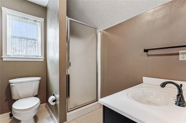 109 Lefleur Dr, Slidell, LA 70460 - bathroom featuring a stall shower, vanity, tile patterned floors, and a textured ceiling