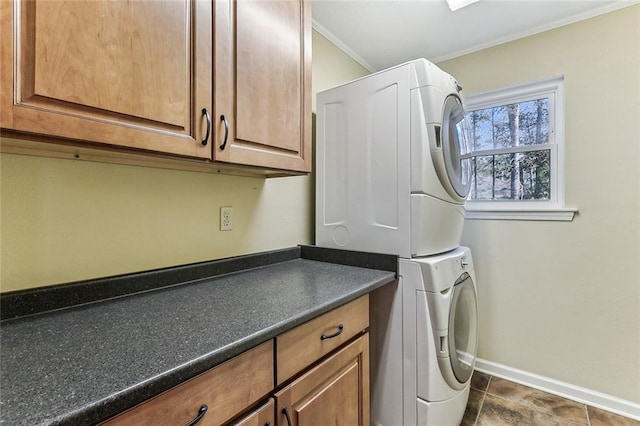109 Lefleur Dr, Slidell, LA 70460 - laundry room with stacked washing machine and dryer, cabinet space, and crown molding