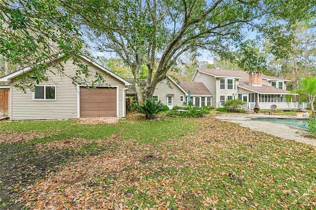 109 Lefleur Dr, Slidell, LA 70460 - view of yard featuring a garage and an outdoor pool