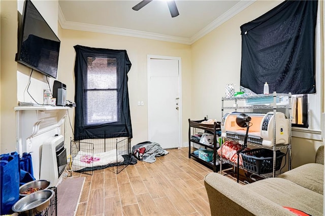 misc room with heating unit, crown molding, and ceiling fan