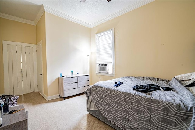 bedroom featuring ornamental molding, cooling unit, a textured ceiling, and ceiling fan