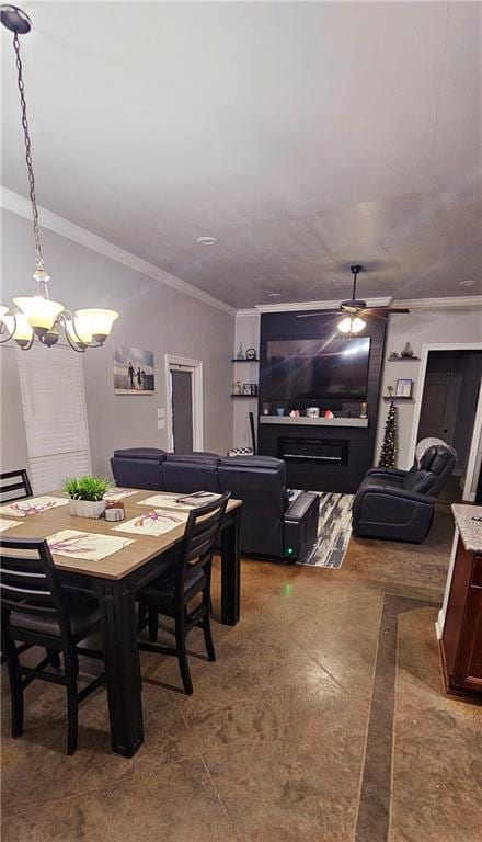 dining room with crown molding and ceiling fan with notable chandelier